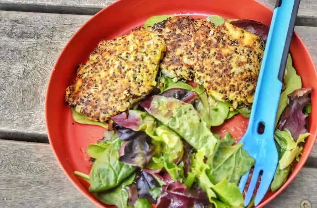 A camping meal on a picnic table.