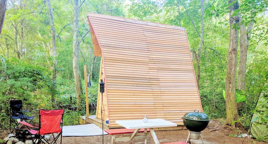 An a-frame available for rent for glamping in Massachusetts.