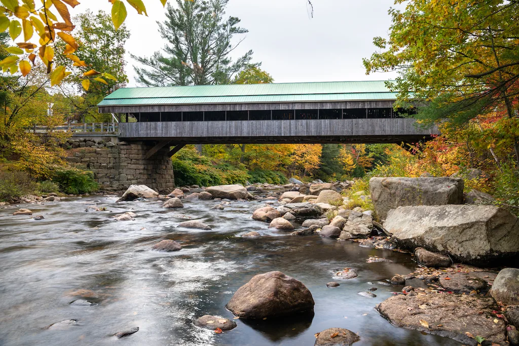 A covered bridge crossing the Ellis River in Jackson, New Hampshire.