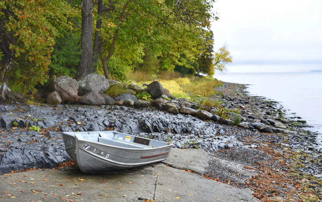 A small boat on the beach at Grand Isle State Park on Lake Champlain in Vermont.