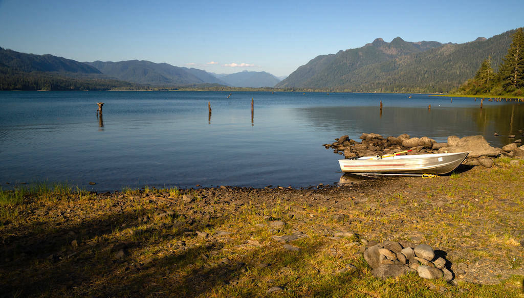 Calm mountain views from the shore of Lake Quinault in Washington.