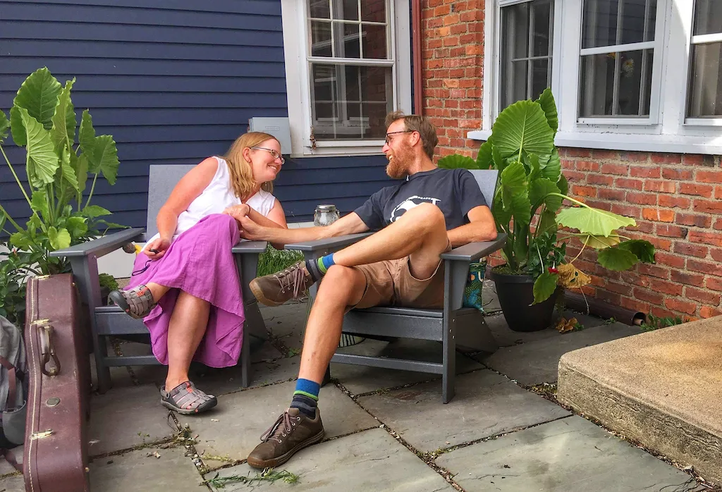 Tara and Eric sitting together outdoors.