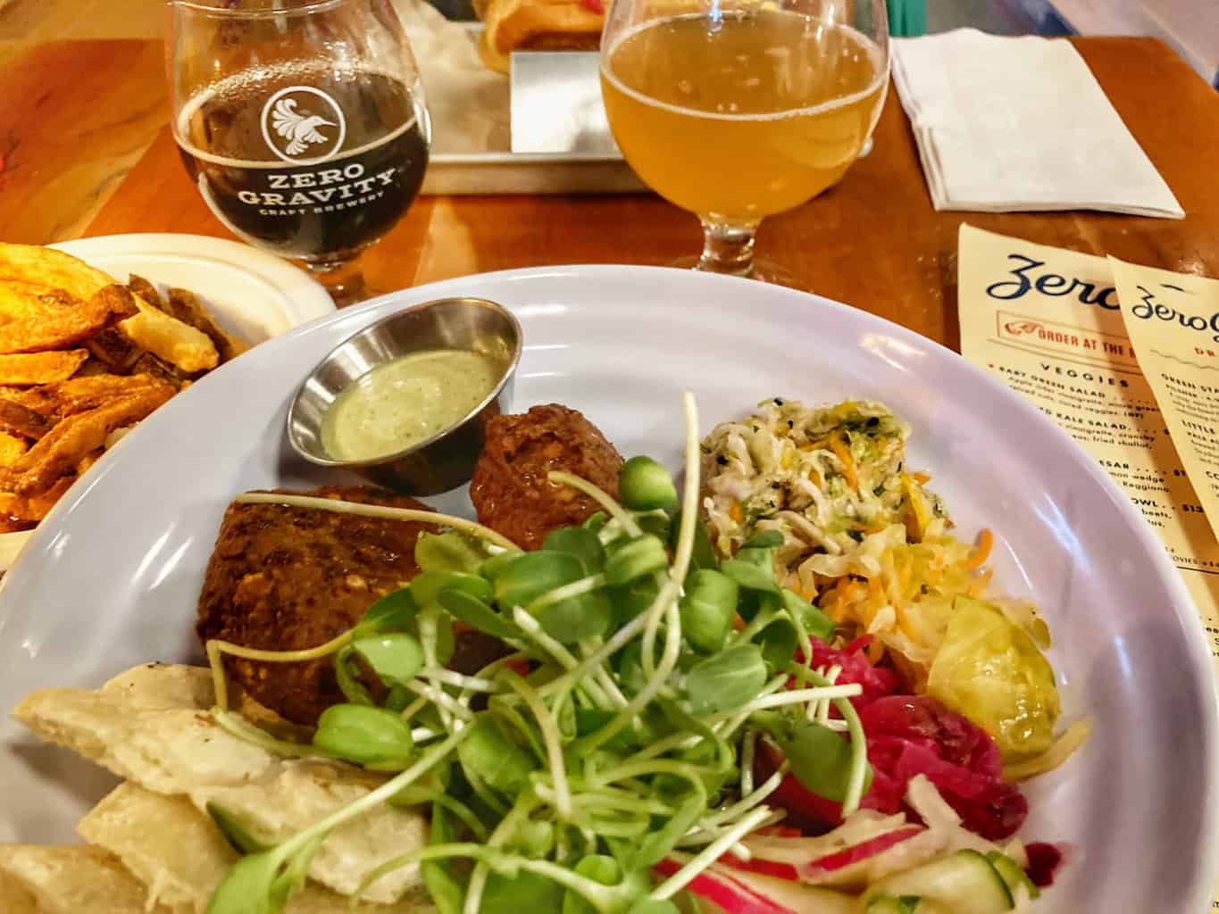 A platter of food and a few beers on the table at Zero Gravity Brewing in Burlington.