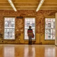 a man stands in a gallery in Mass MoCA in the Berkshires.