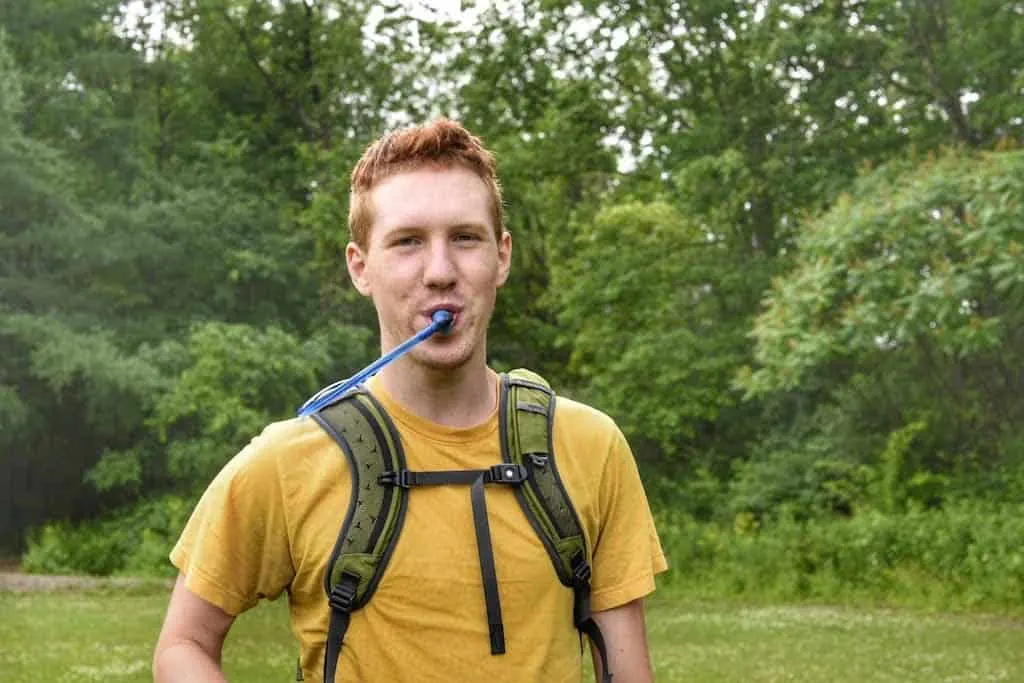 Gabe demonstrated how to use the hydration reservoir that came with his backpack. 