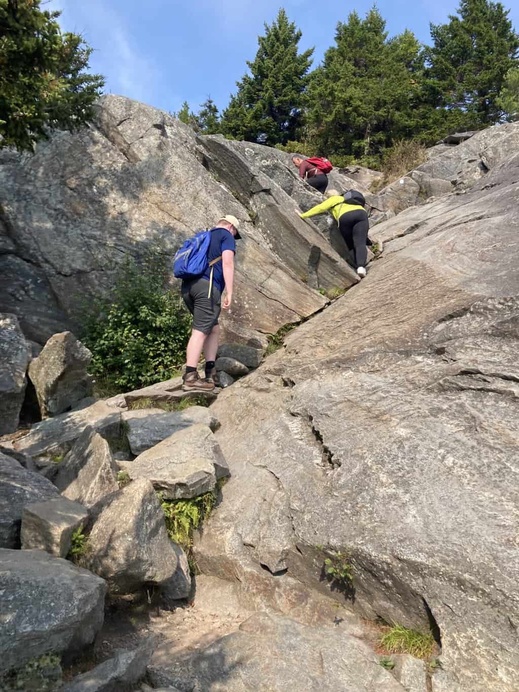 Climbing boulders on Mount Monadnock.