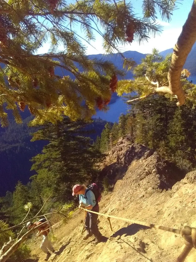 Tara uses ropes to climb to the top of Mount Storm King.