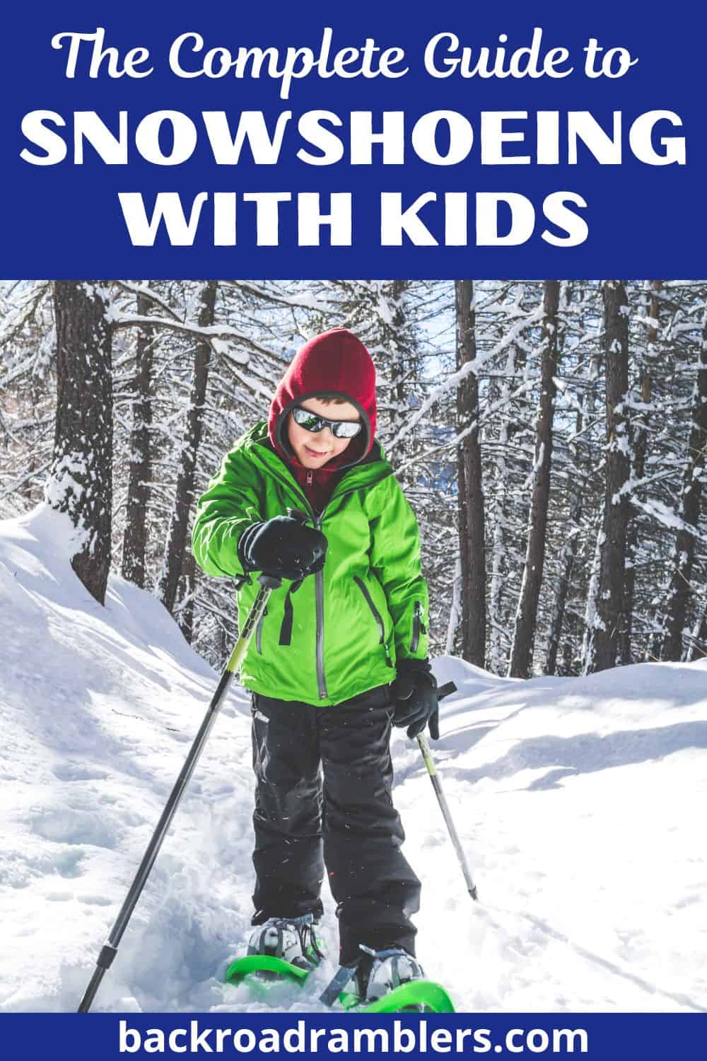 A boy walks through the snowy woods wearing a green jacket and snowshoes. Text overlay: The Complete Guide to Snowshoeing with Kids