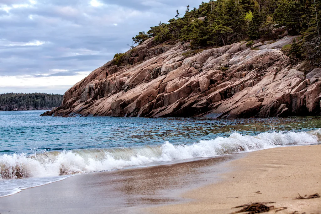 Waves crashing on the beach in Acadia National Park in Maine.