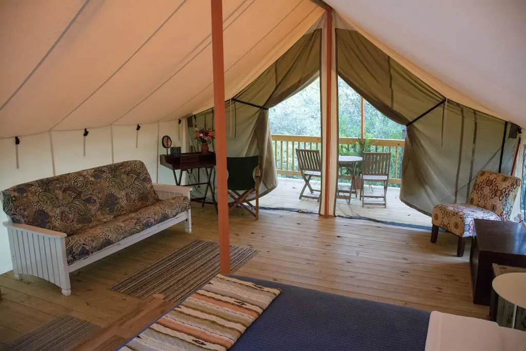 The interior of a safari glamping tent at Seneca Sol in the Finger Lakes.