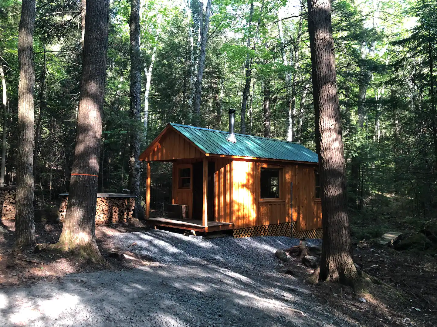 A tiny, rustic cabin tucked away in the woods.