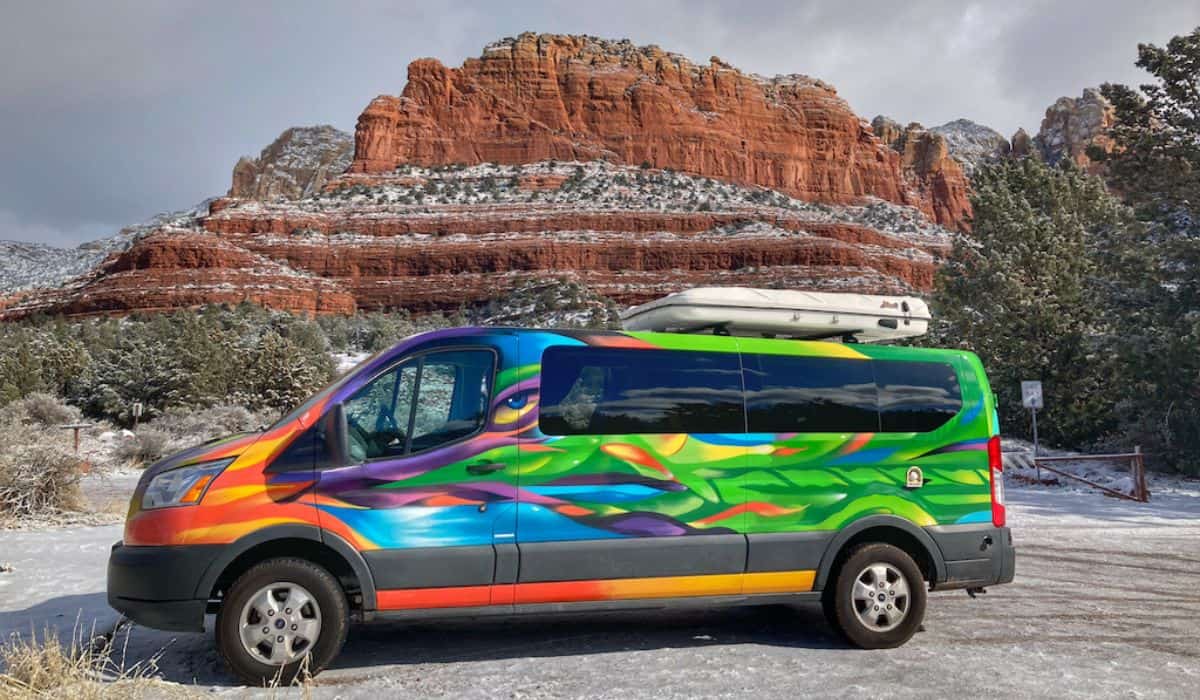 An Escape Campervan in front of the red rocks of Sedona.