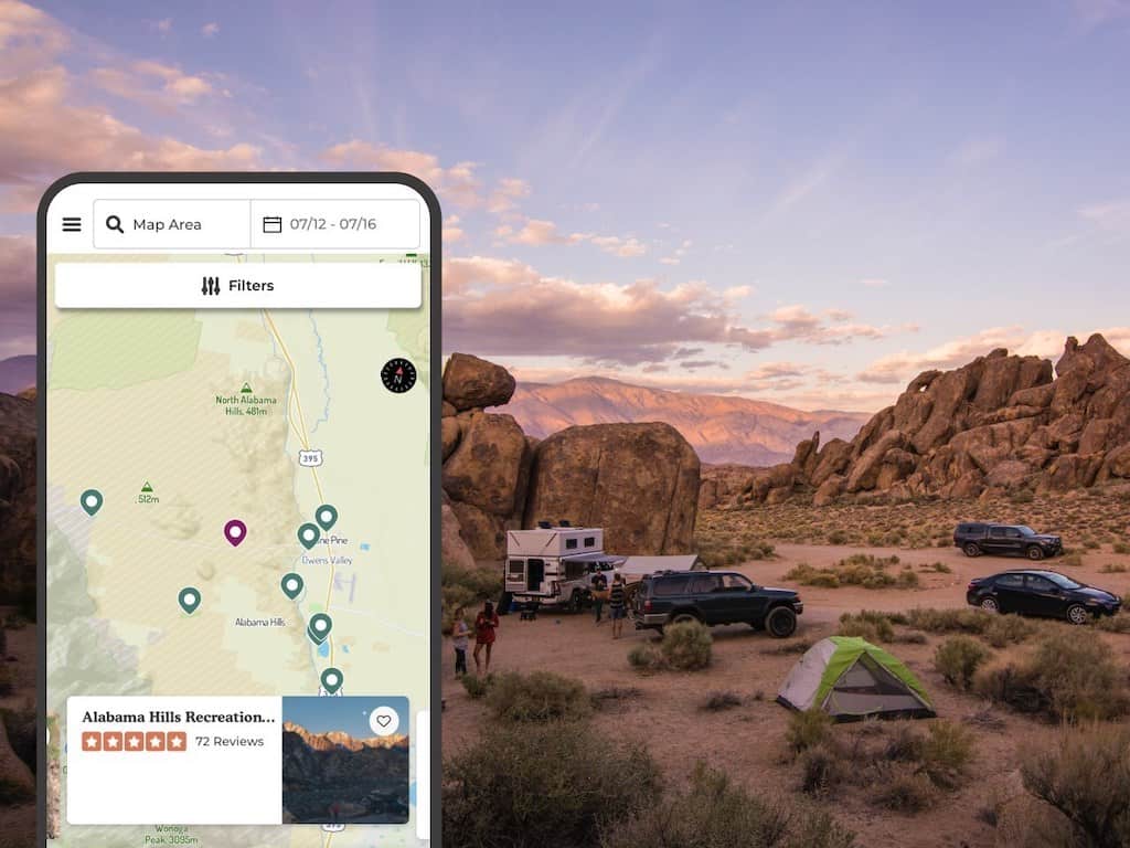 A close-up of The Dyrt camping app with a mountain backdrop.
