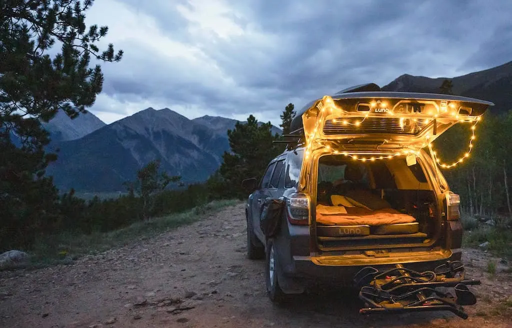 Luno string lights hang around the tailgate of a car.