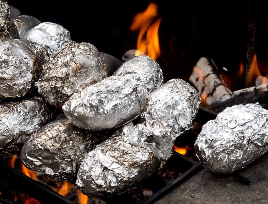 Baked potatoes on a campfire.